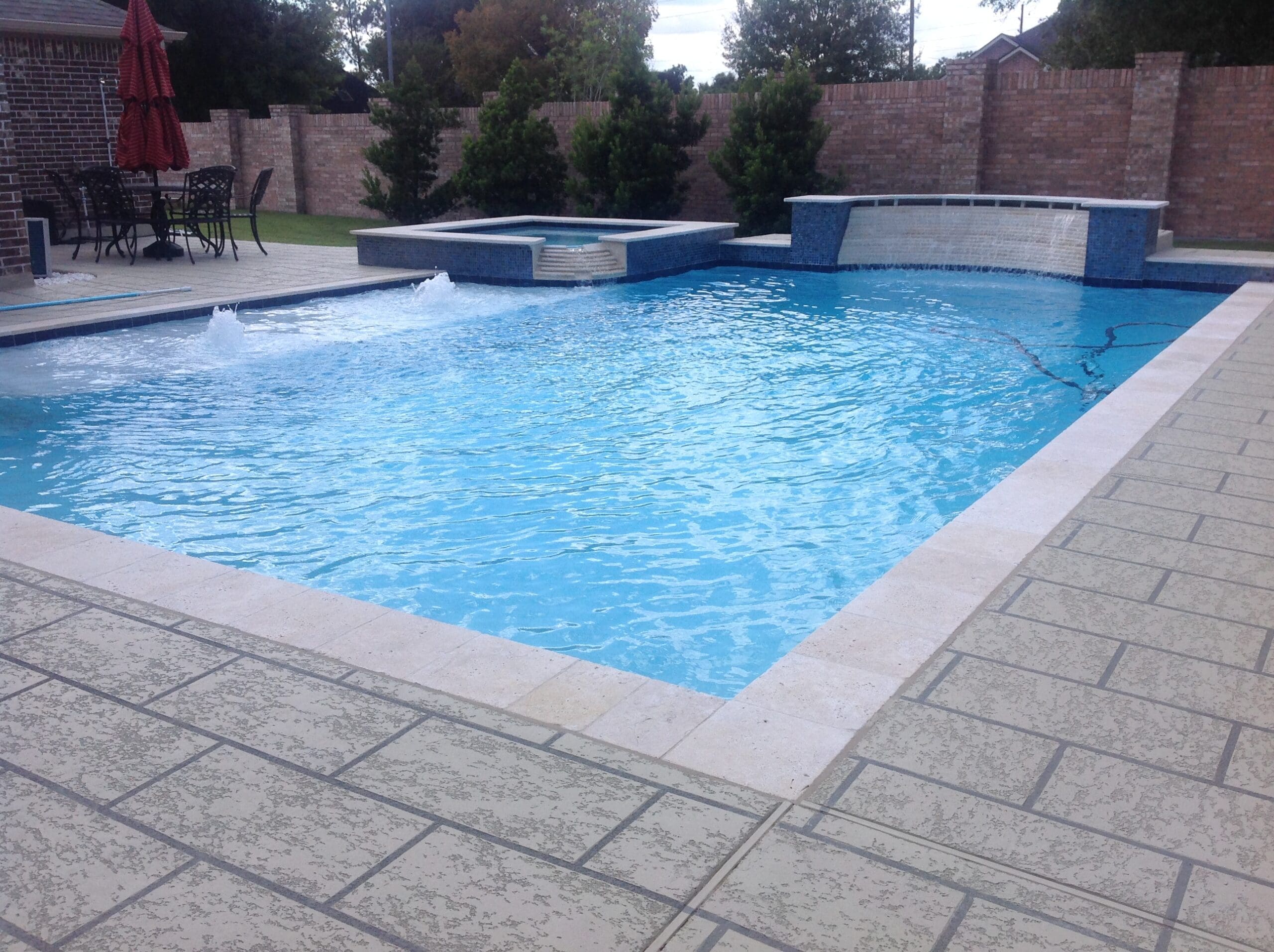 square pool with deck bubblers and spa